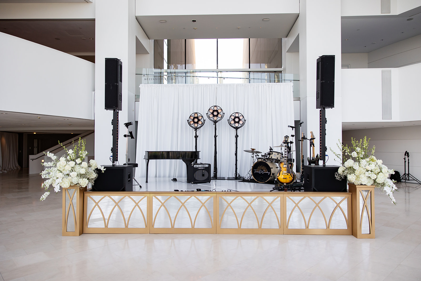 Video wall on stage with white facade and stairs at kauffman
